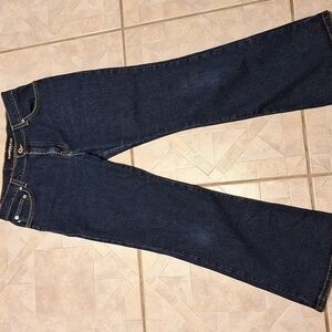 Q  Express solid blue stretch low rise flare jeans size 9/10. EUC